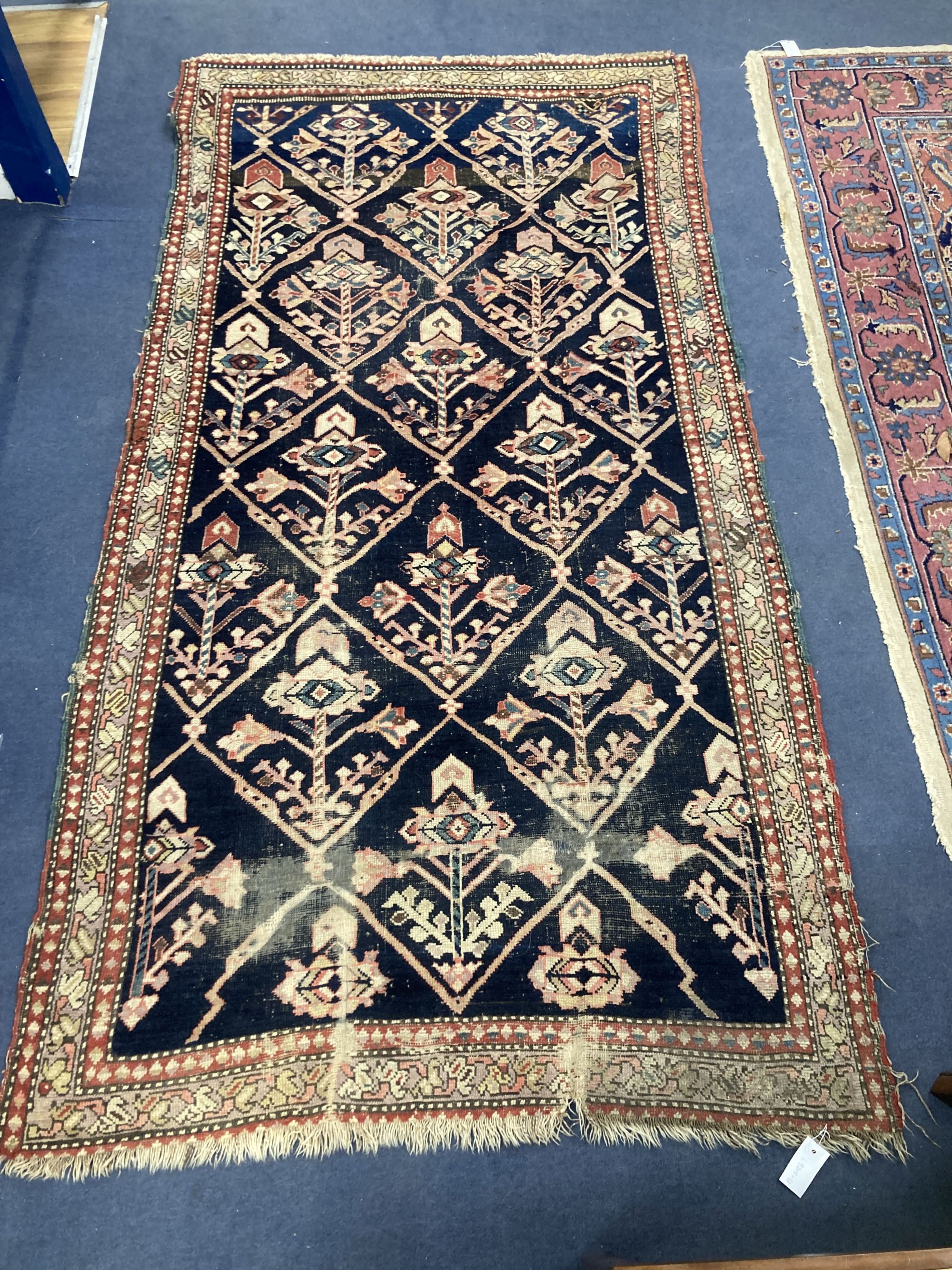 A Caucasian blue ground rug, 230 x 124cm